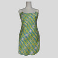 Silk slip dress in lime geometric