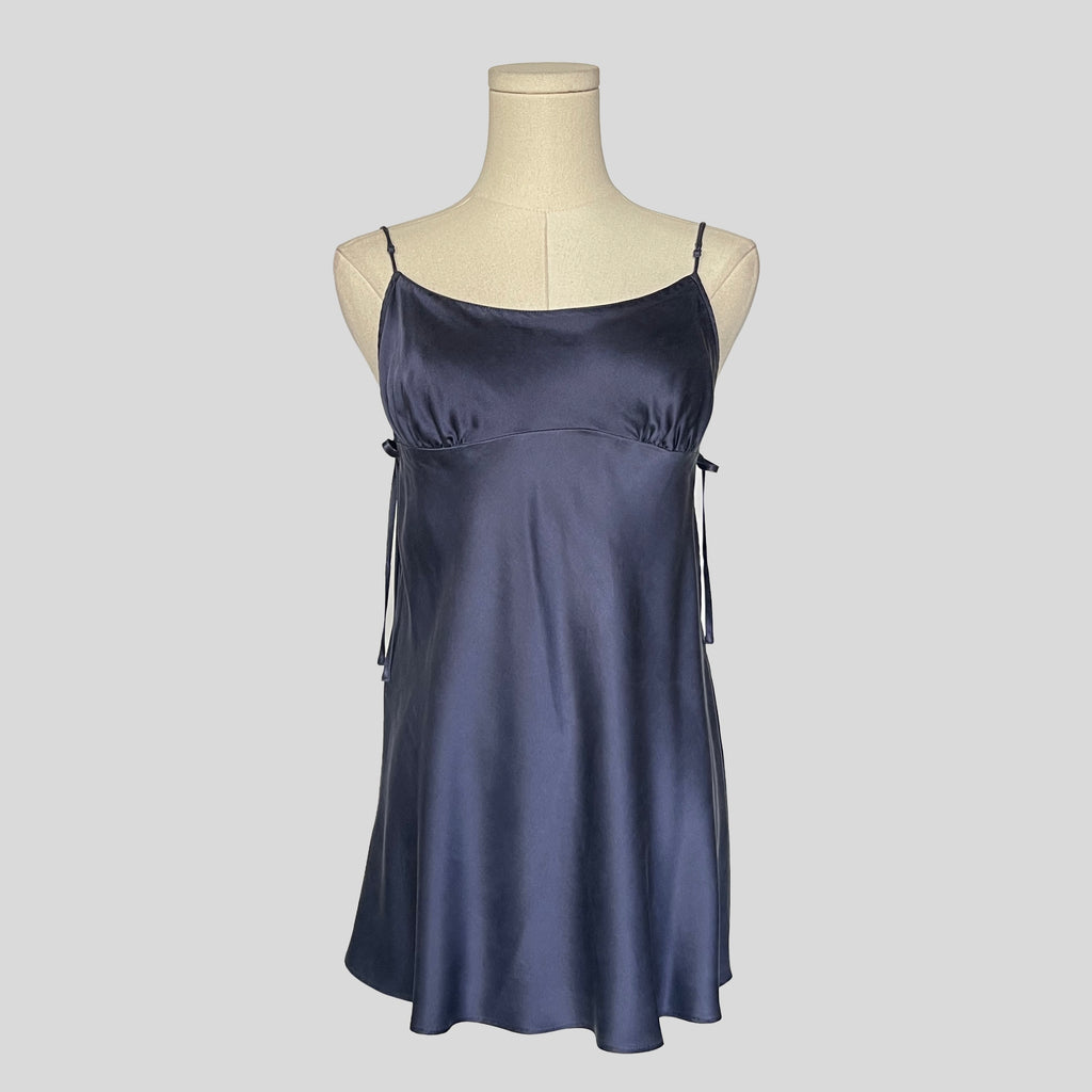 Silk slip dress with side cutouts and bows in navy