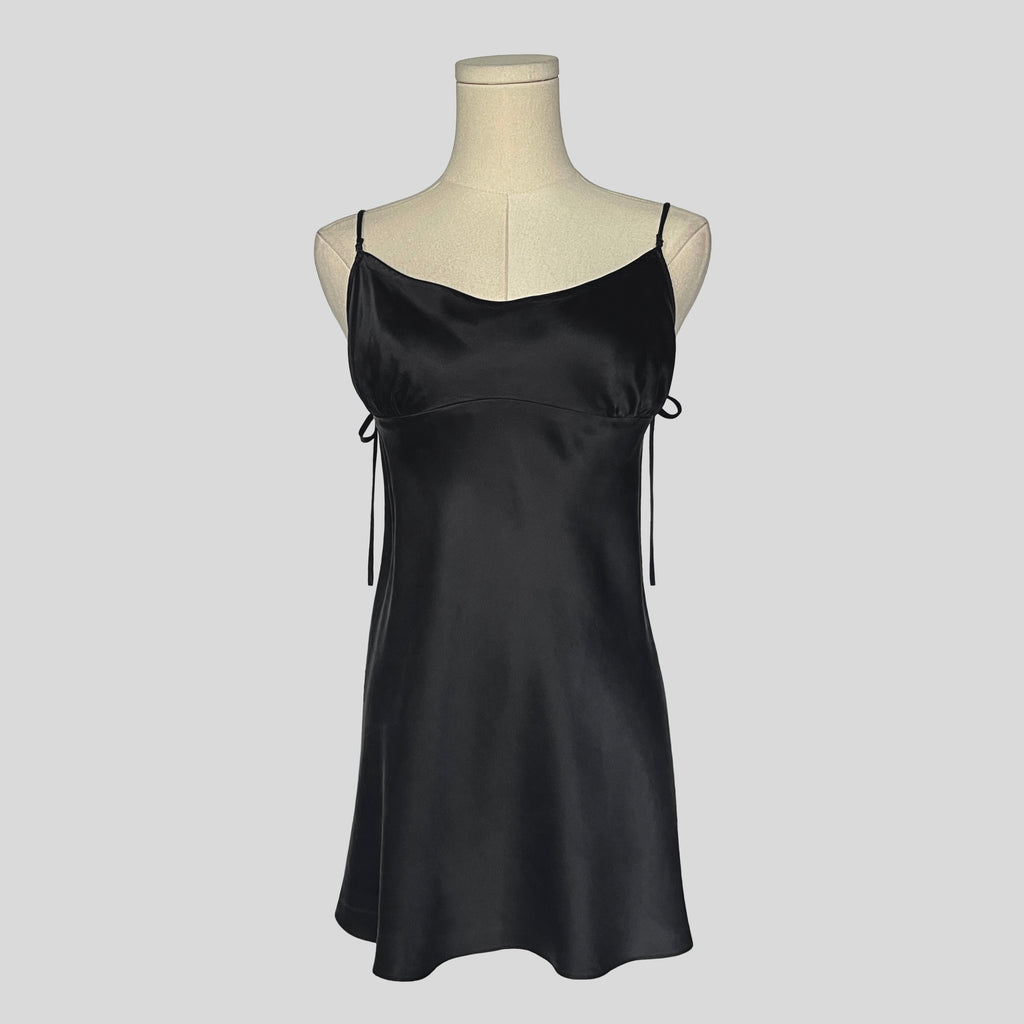 Silk slip dress with side cutouts and bows in black
