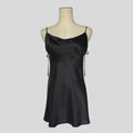 Silk slip dress with side cutouts and bows in black