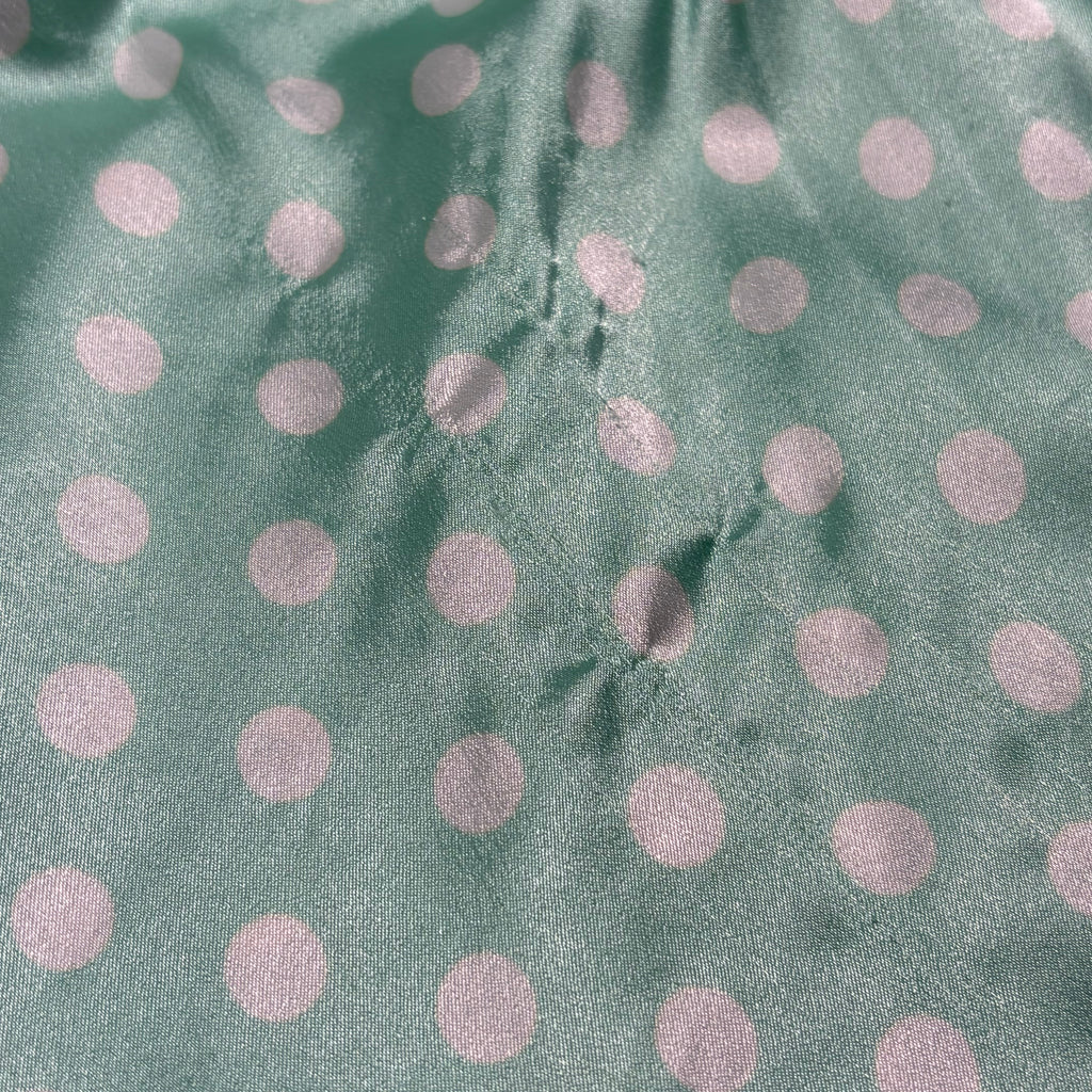 Silky polka dot ruffled slip in teal and white