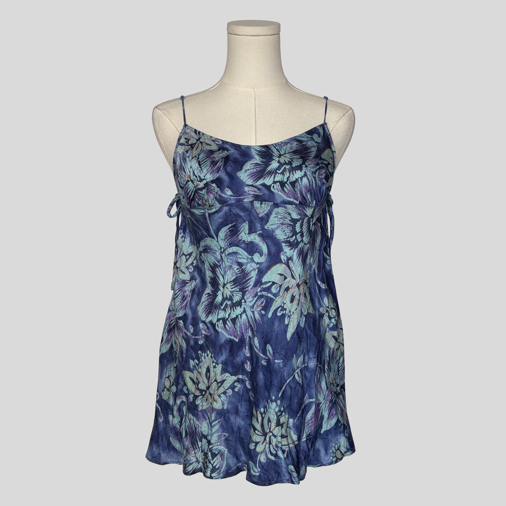 Silk slip dress with side cutouts and bows in blue floral