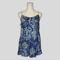 Silk slip dress with side cutouts and bows in blue floral